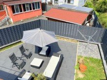 Blick von Dachterrasse auf Gartenterrasse Modernisiertes Einfamilienhaus mit pflegeleichtem Garten in Freilingen